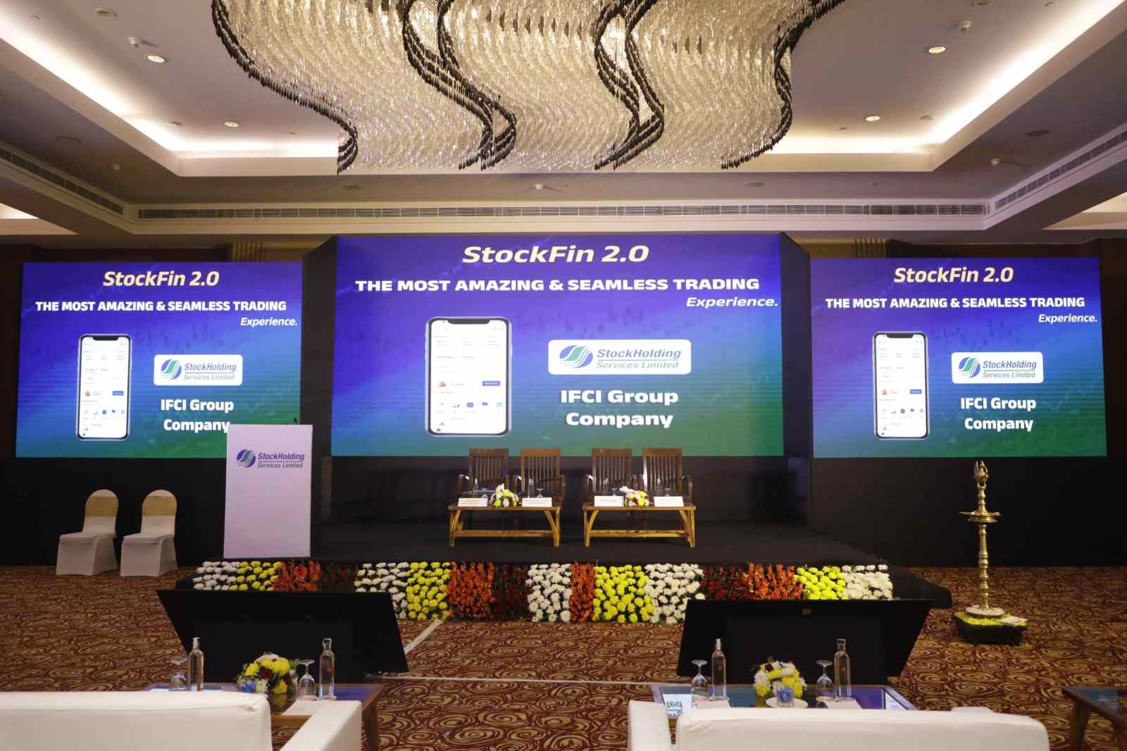 StockHolding Services StockFin 2.0 launch - three-screen LED stage with lamp-lighting setup