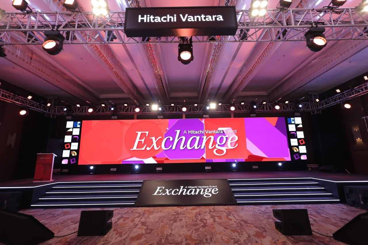 Hitachi Vantara Exchange - stage set, LED wall and truss lighting